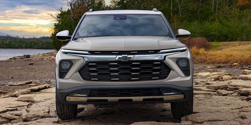 front view of a 2026 trailblazer parked on a rocky terrain next to water