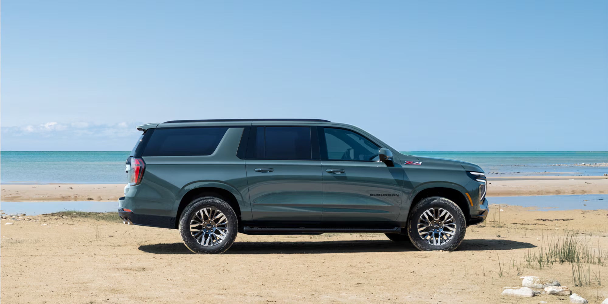 A blue suv sitting parked.