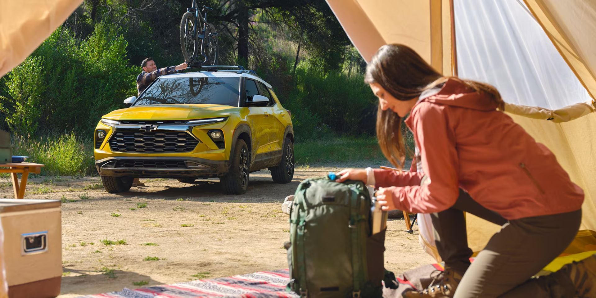 A yellow suv sitting parked.