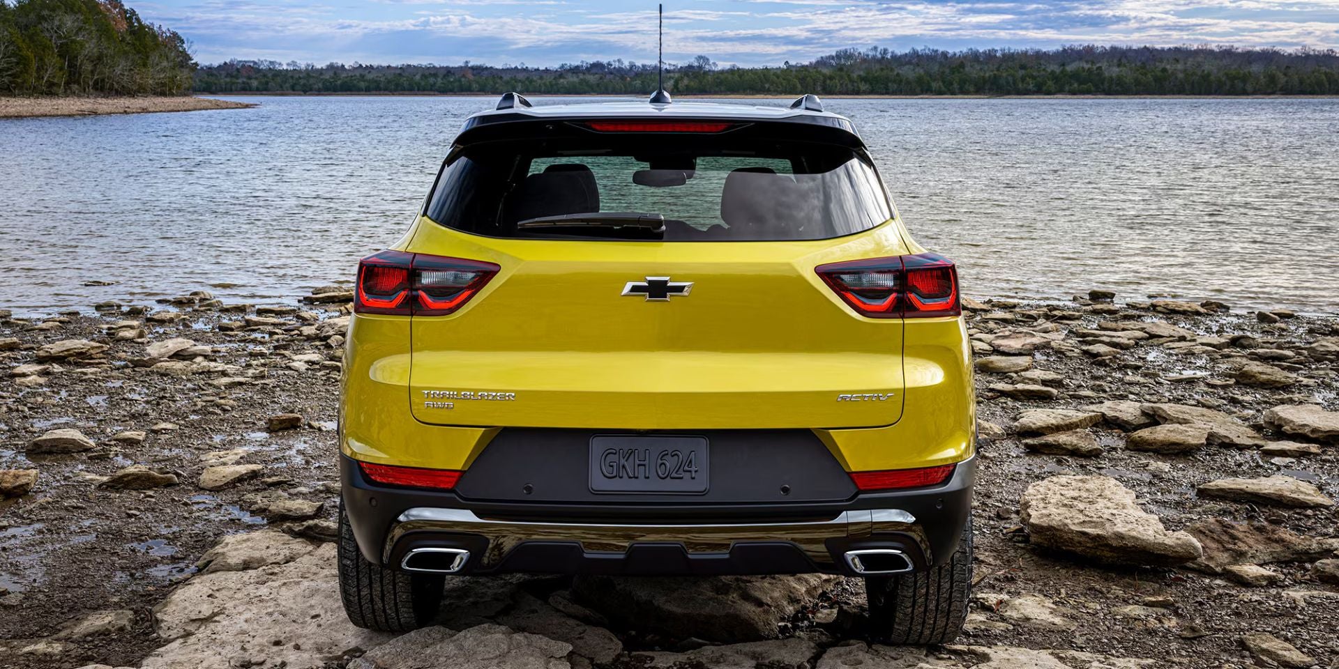 A yellow suv sitting parked.