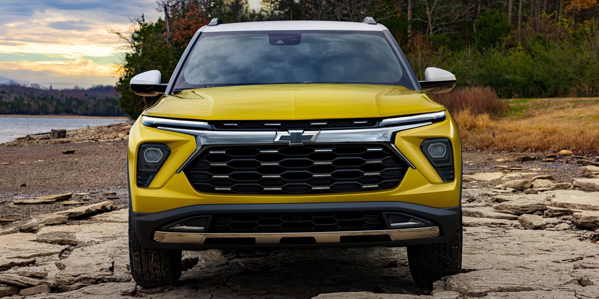 A yellow suv sitting parked.