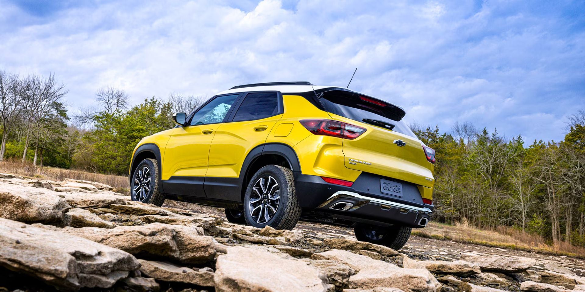 A yellow suv off-road.