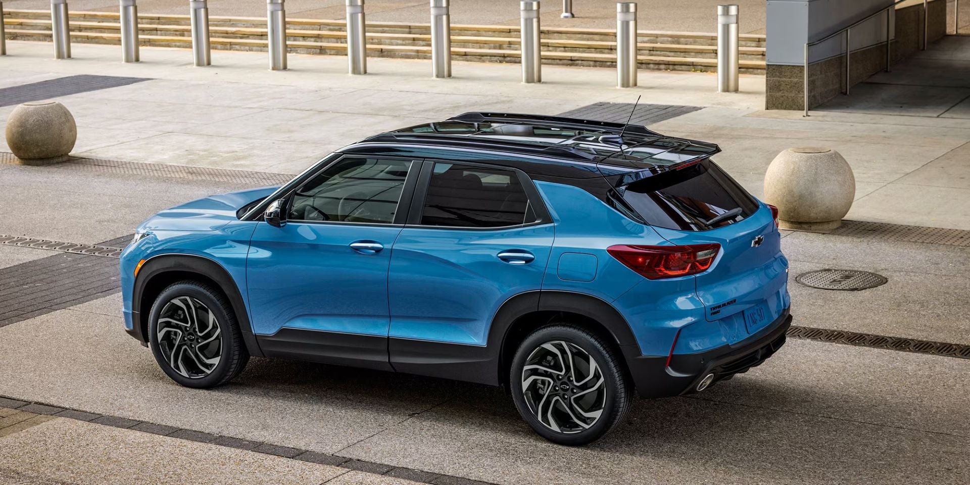 A blue suv sitting parked.