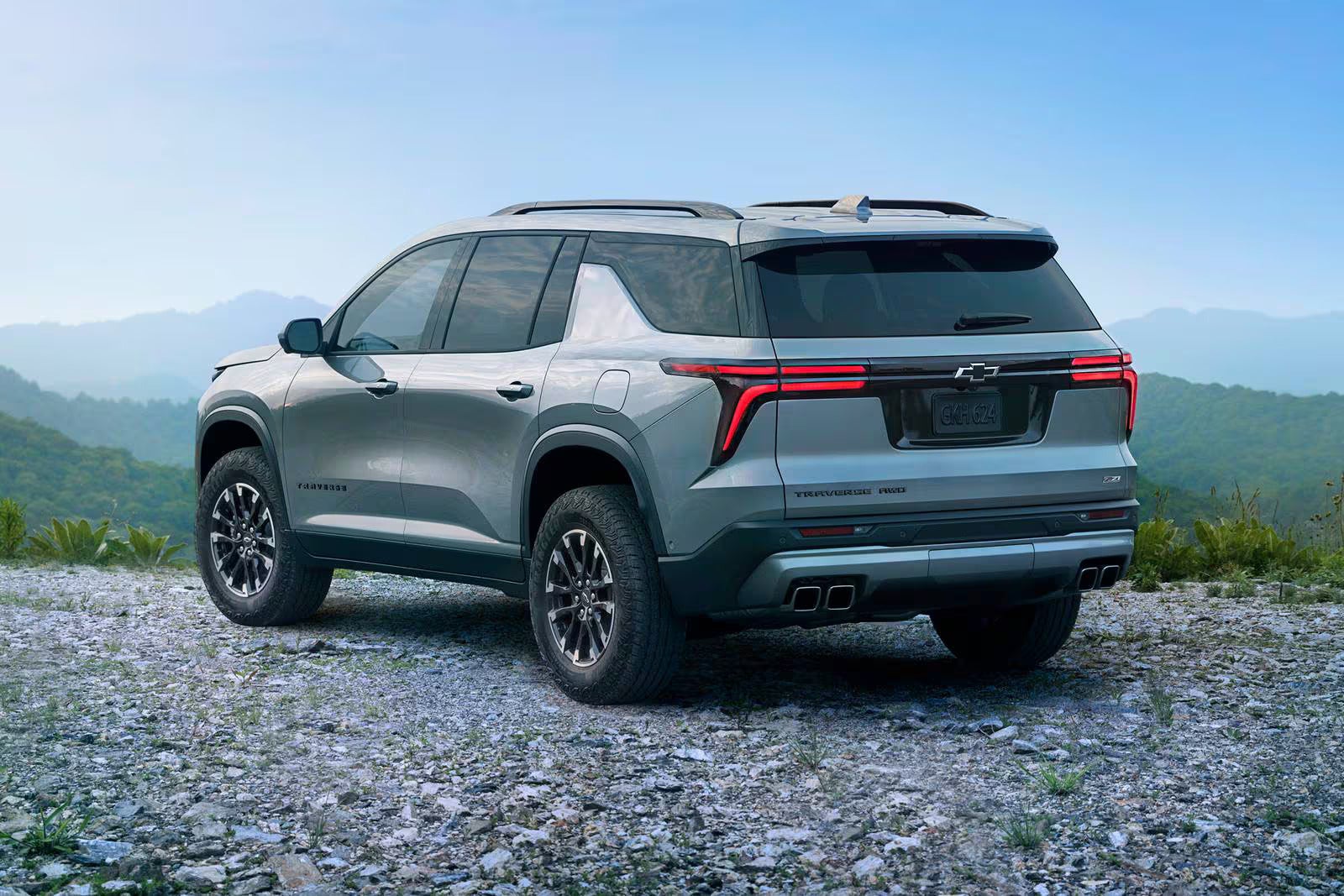 A gray suv sitting parked.