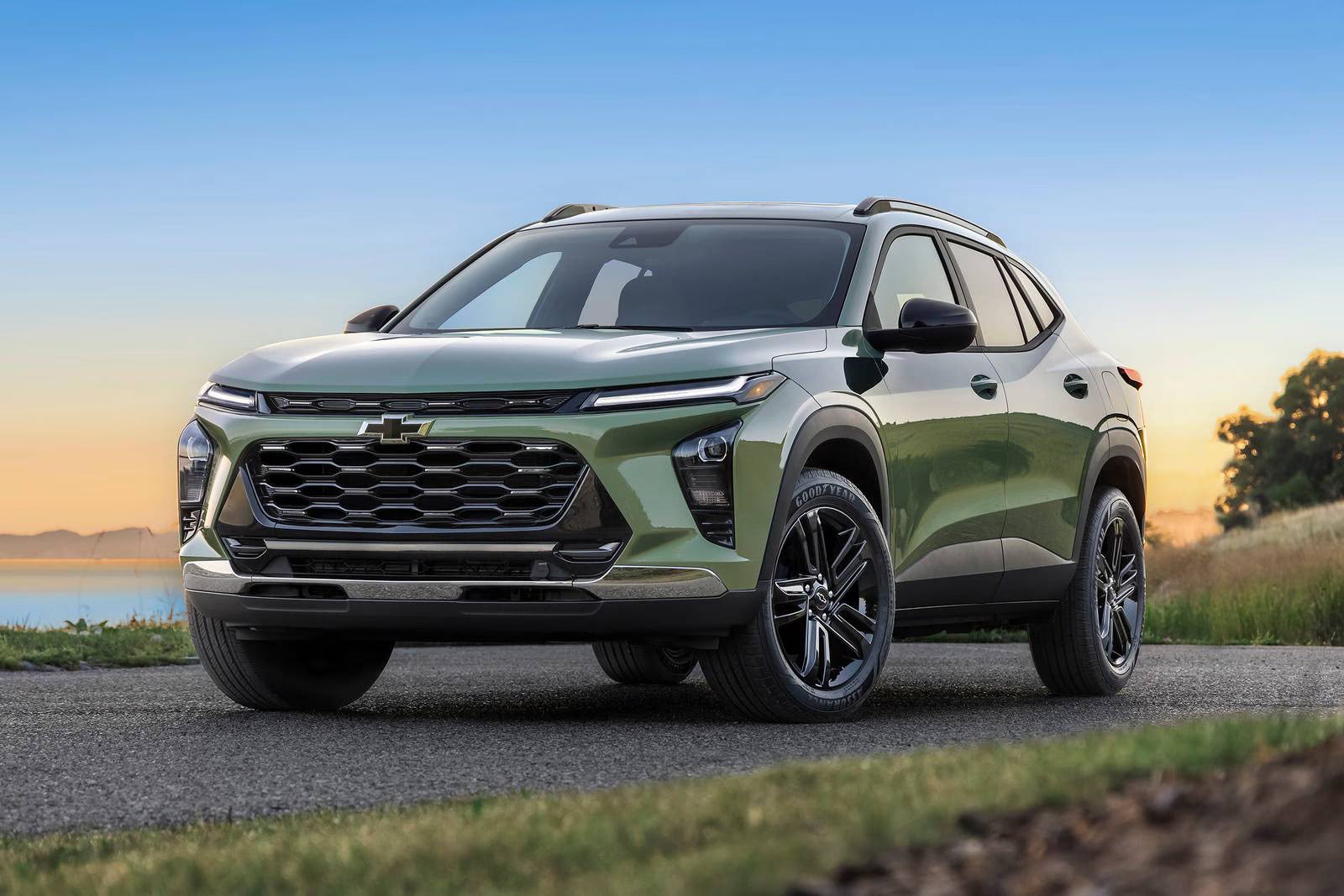 A green suv sitting parked.